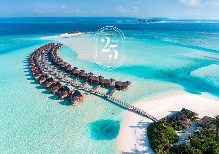 Aerial view of the overwater villas at Anantara Dhigu Maldives Resort