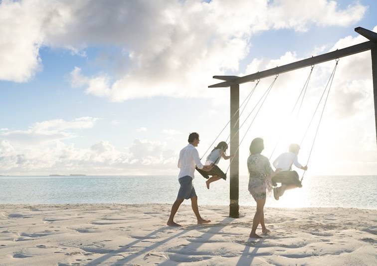 Family swing on the beach at Anantara Dhigu Maldives
