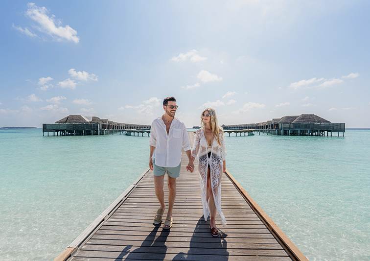The couple at the Overwater villa at Anantara Kihavah Maldives